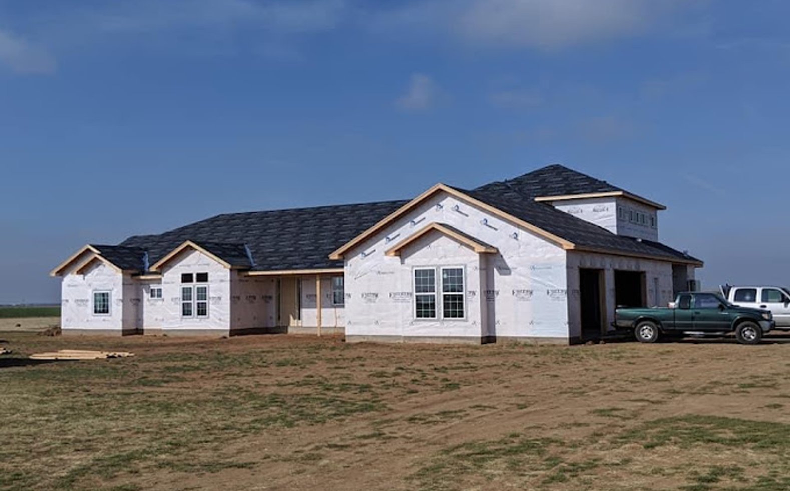 Contractor working
						on roof
