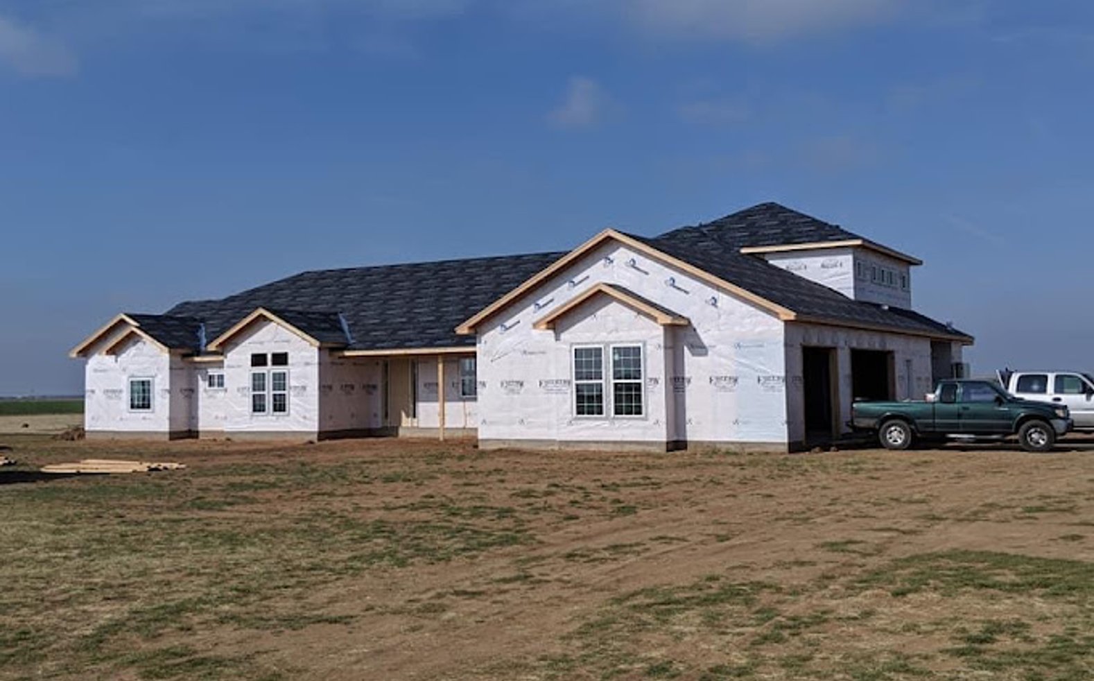 Contractor working
						on roof